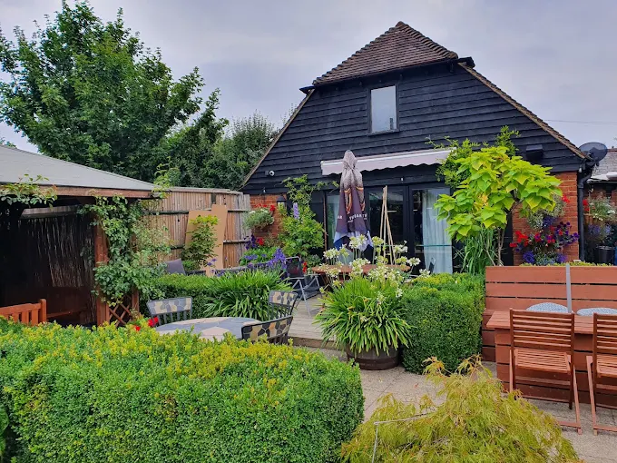 Back of The Queen's Head Kingsnorth beer garden holding events in Kingsnorth
